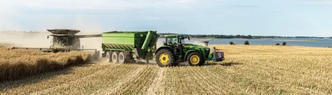 Combine and Grain cart in field